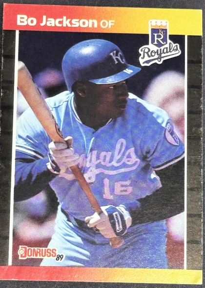 Front of 1989 Donruss Donruss Baseball Bo Jackson #208 Base, a baseball card front featuring a player in a blue Kansas City Royals uniform with the number 16, holding a bat in a batting stance. The top banner…