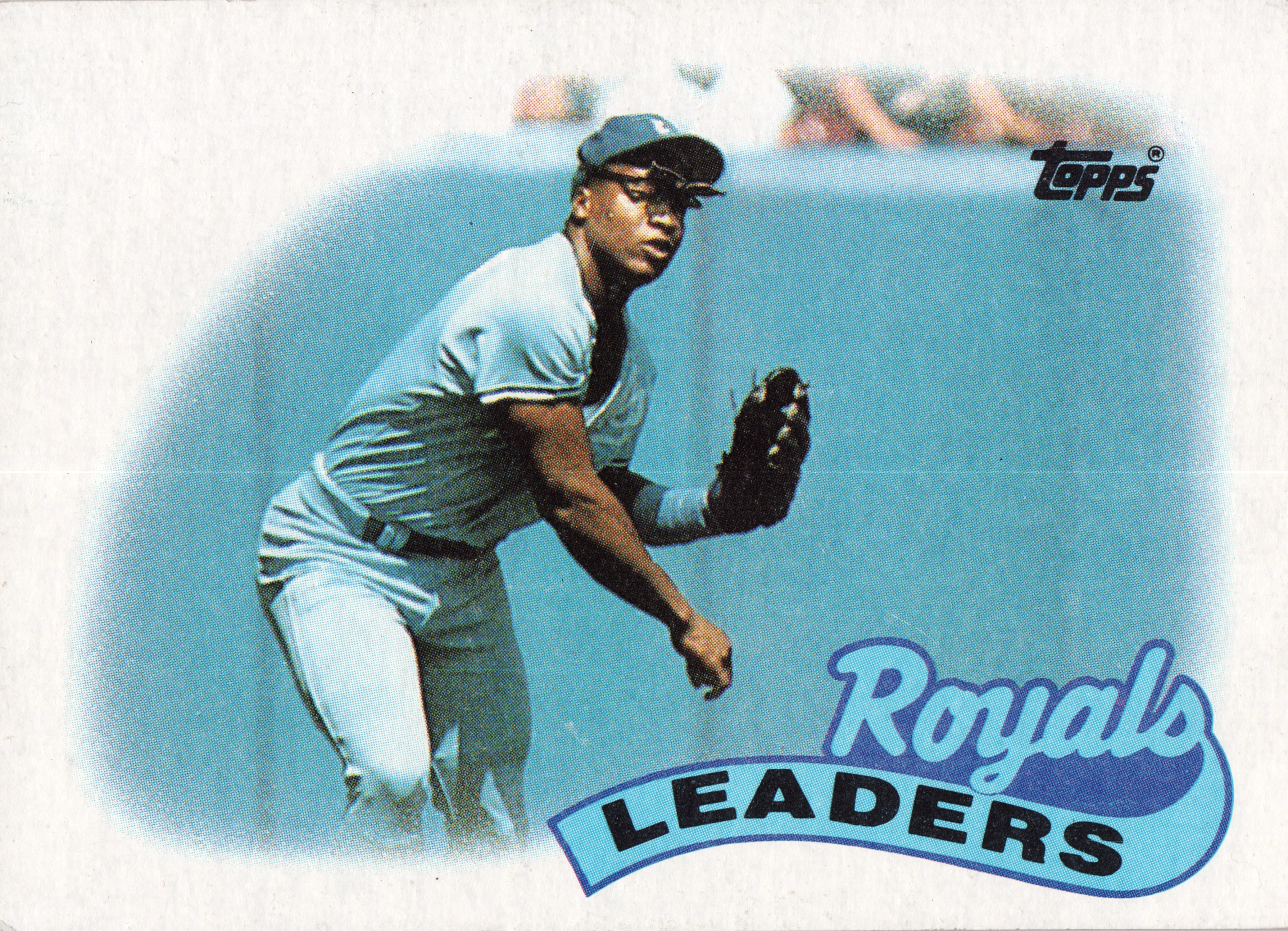 Front of 1989 The Topps Company, Inc. Baseball Unidentified collectible card #789 1989 Topps #789, a baseball player in a white pinstriped uniform with a cap and fielding glove, crouching in a ready position, set inside a circular vignette against…