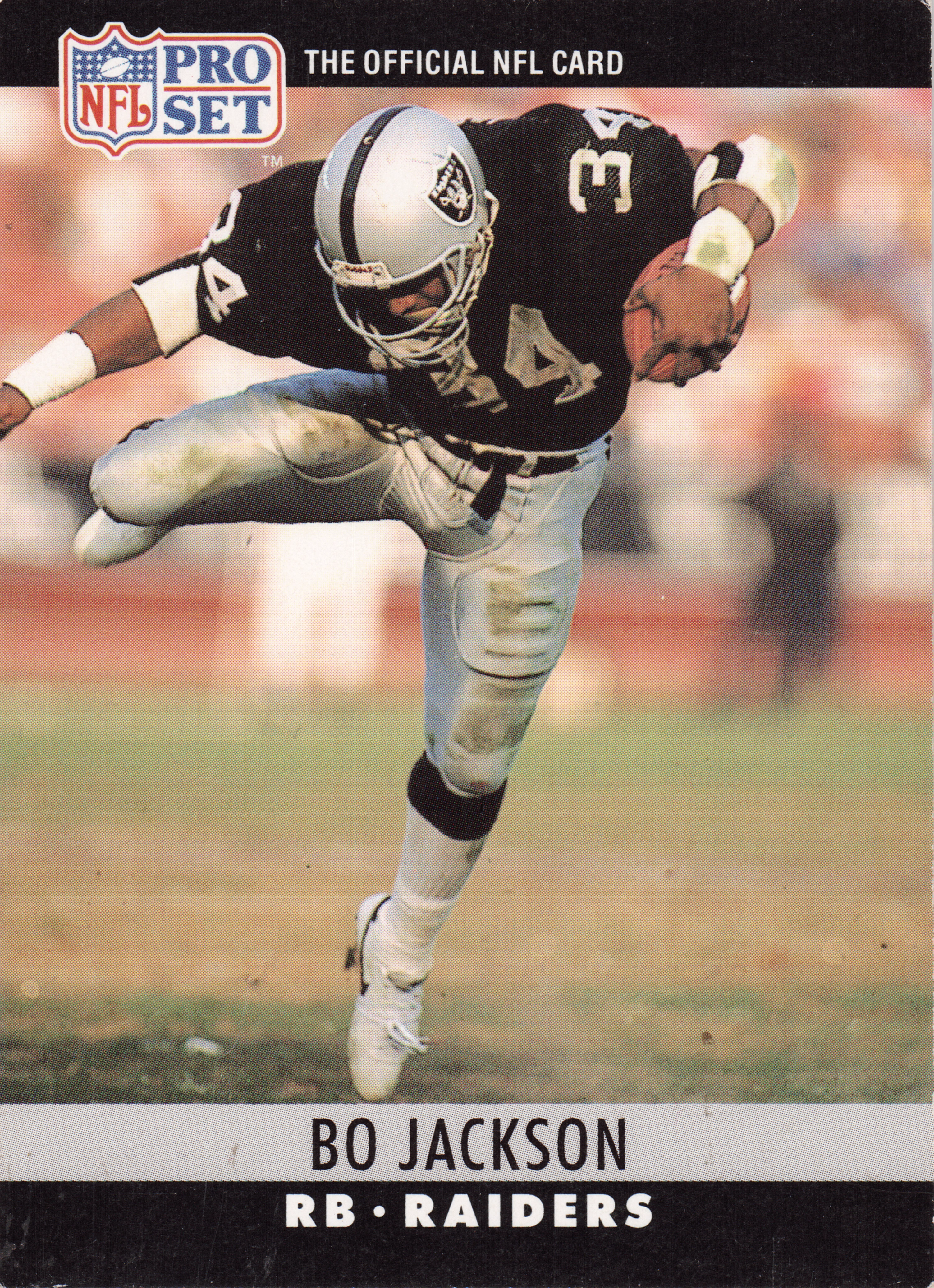 Front of 1990 Pro Set Pro Set Bo Jackson #155, action photo of a Raiders player in black jersey number 34 and silver helmet carrying a football, with Pro Set NFL logo banner at top and…
