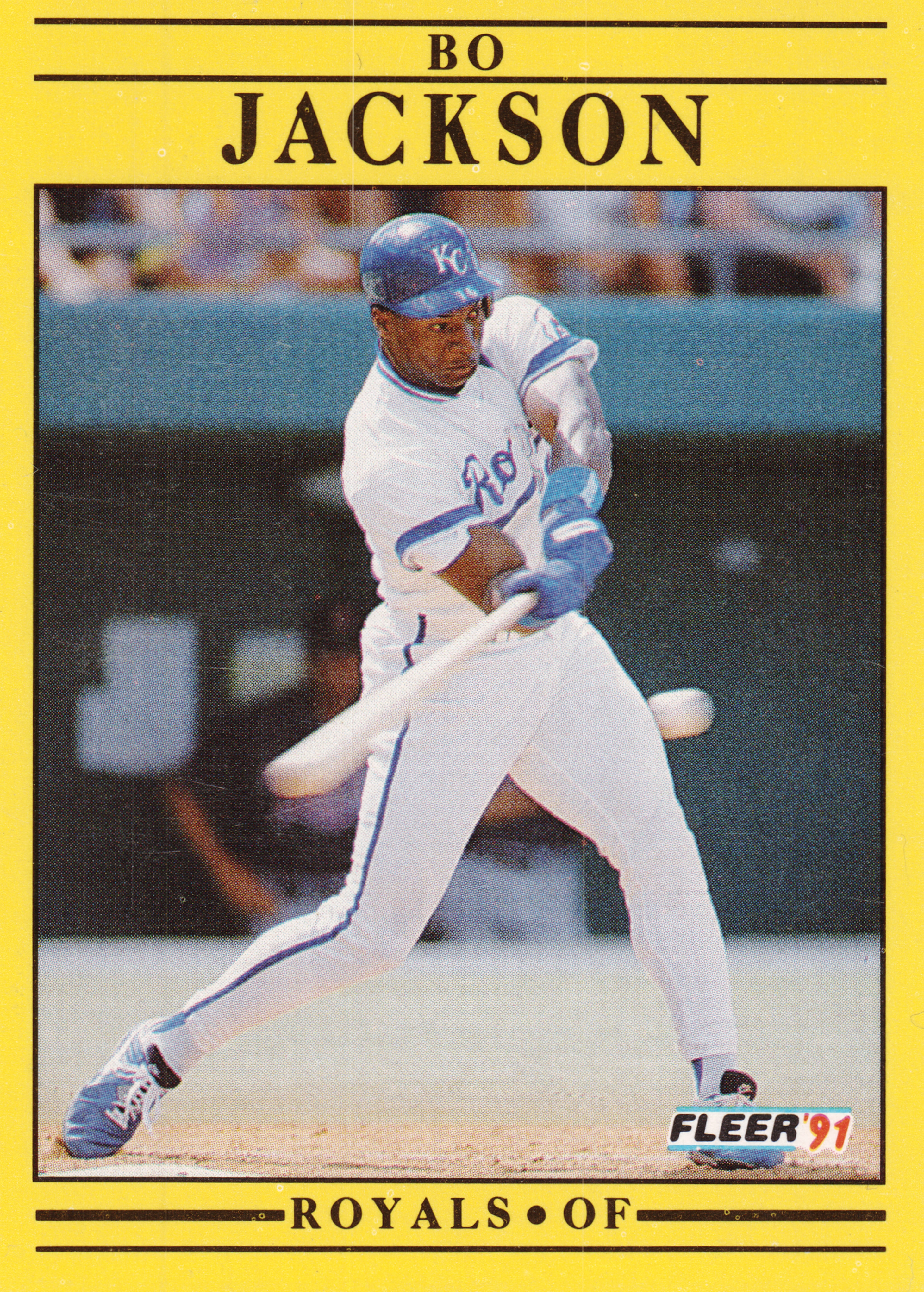 Front of 1991 Fleer Corp. Fleer Bo Jackson #561, yellow-bordered card with black rules. Player name 'BO JACKSON' printed at top in black serif capitals. Action photo of a batter in a white Kansas…
