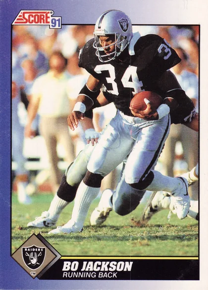 Front of 1991 Score Score 91 Bo Jackson #100 1991 Score Bo Jackson #100, action photo of a Raiders player in black jersey number 34 carrying a football, with a blue border and black name bar at bottom reading BO JACKSON…