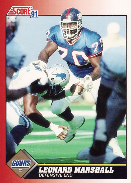 Front of 1991 Score Score Leonard Marshall #170, action photo of a Giants defensive player in blue #70 jersey blocking a Detroit Lions player; red gradient border, Score 91 logo top left, Giants…
