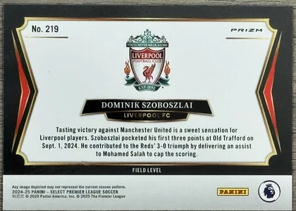 Back of 2024-25 Panini Select Premier League Soccer Dominik Szoboszlai #219 2024-25 Select Premier League Soccer #219 Dominik Szoboszlai Red Prizm, the back of a soccer trading card with a white central panel framed by a black border with red and gold foil accents. The card is rotated 90 degrees…