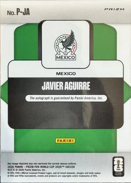 Back of 2026 Panini 2026 Panini Prizm FIFA World Cup 2026 Soccer Javier Aguirre #P-JA Penmanship Prizm autographed, the back of a Panini Prizm soccer card, encased in a clear CardShare 35pt protective sleeve, resting on a gray wood-grain surface. The card features…